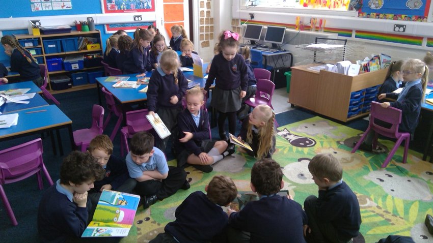 Image of Year 1 and Year 4 shared reading